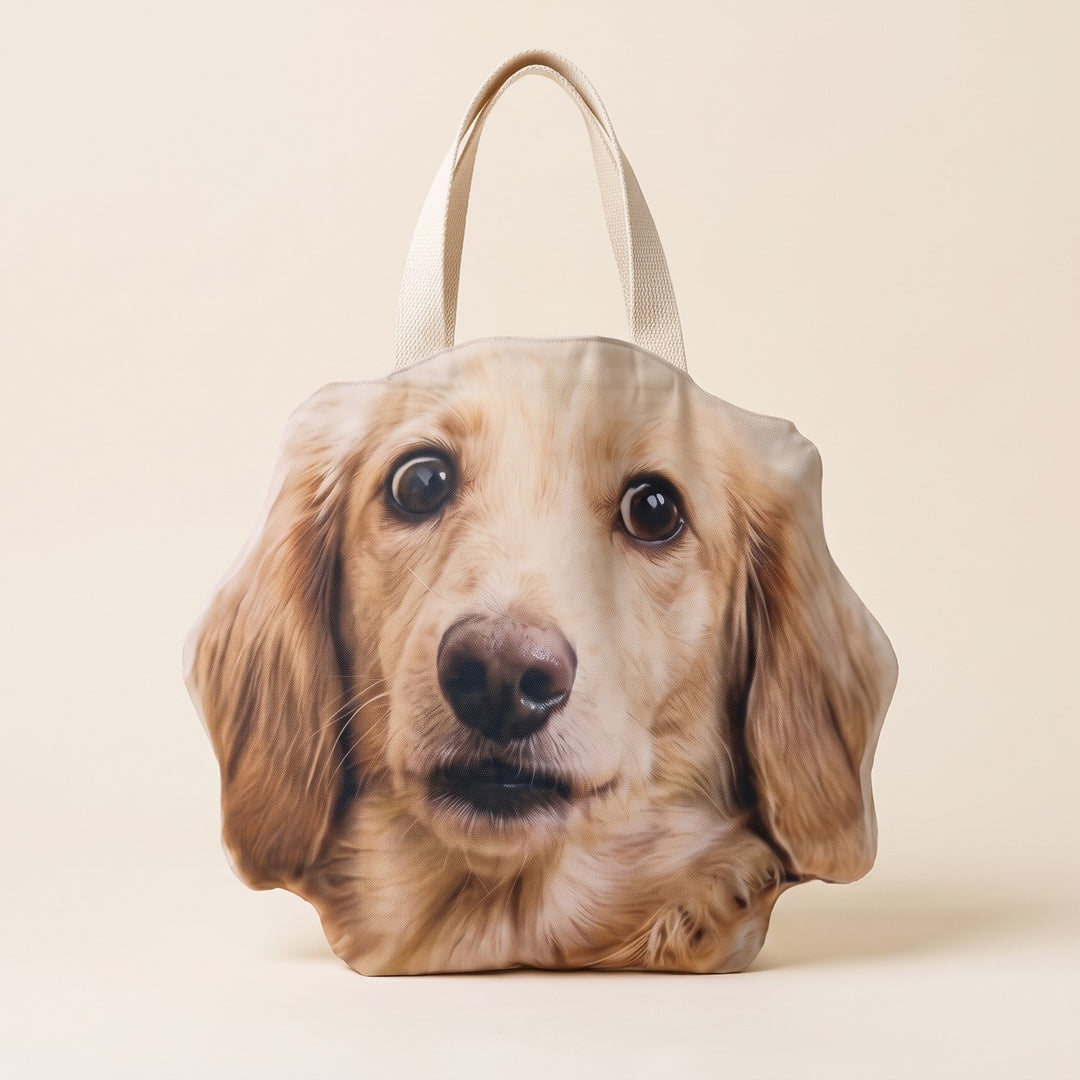 The tote cut to the dog's head shape on a plain background