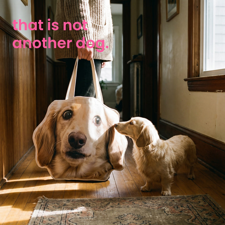 The real dog sniffing the tote shaped like its own face