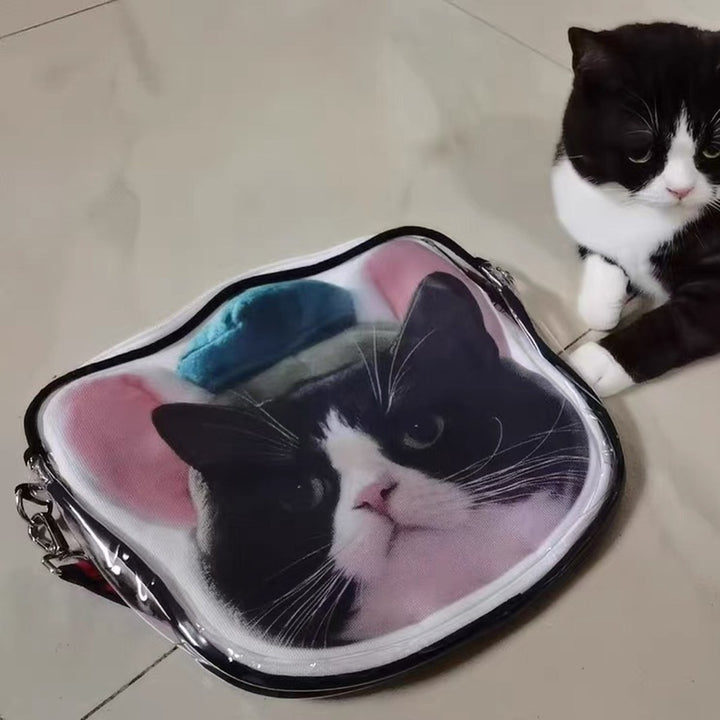 A cat reaching out to a bag printed with its own face